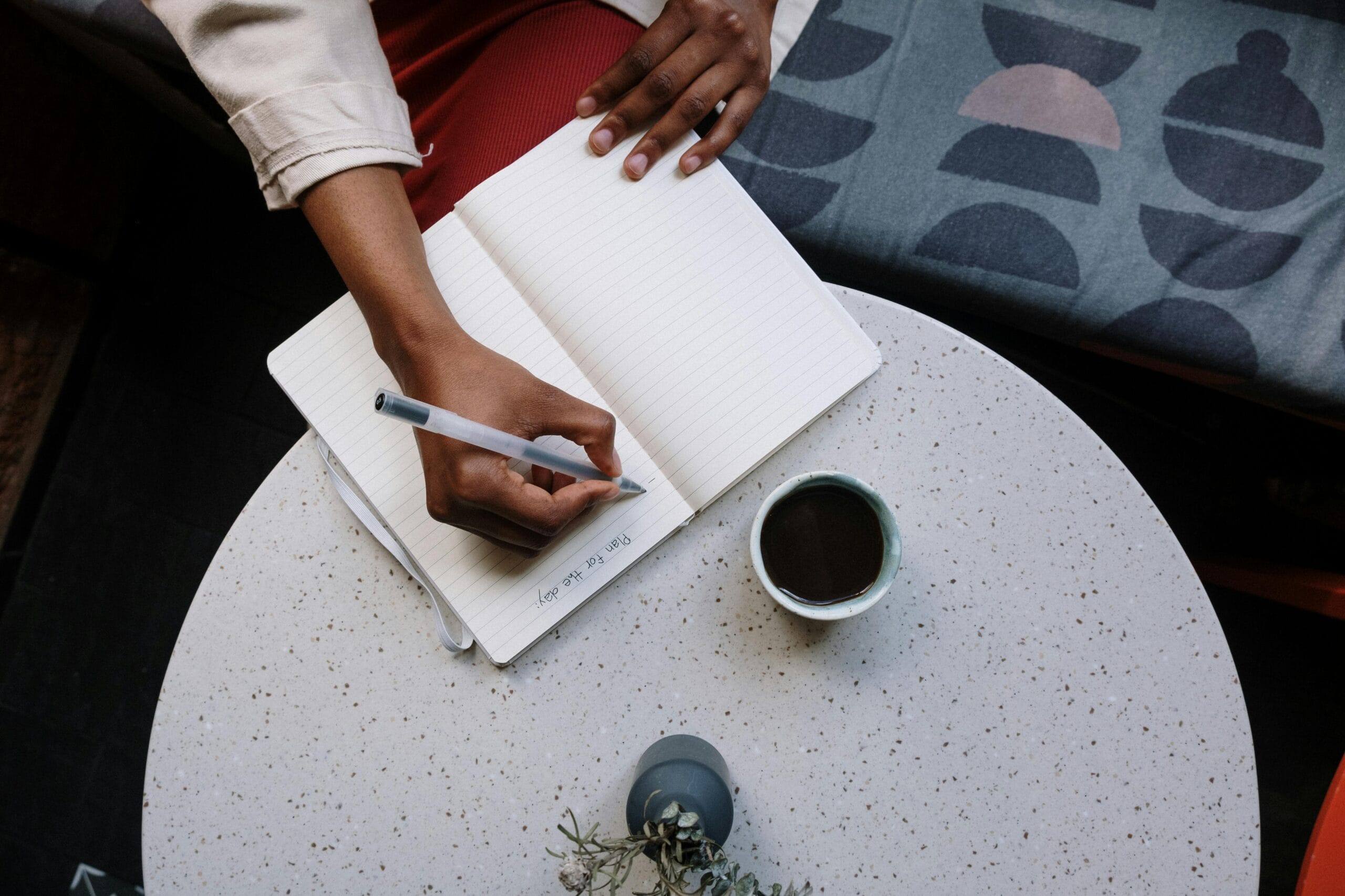 a person writing in a notebook